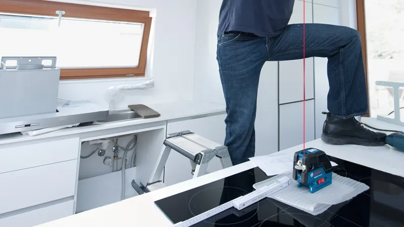 Laser leveling tool with buttons and display, labeled GCL 25.