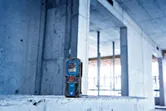 Laser distance measurer, construction site.