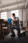 Bosch GBS 750 belt sander used for wood surface sanding.